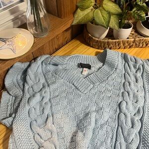 light blue sweater